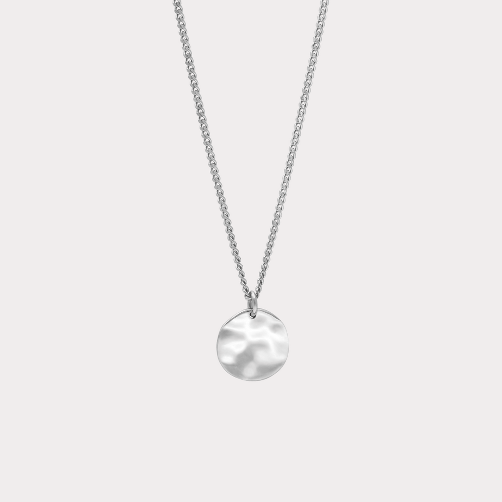 close up detail of front of silver pendant